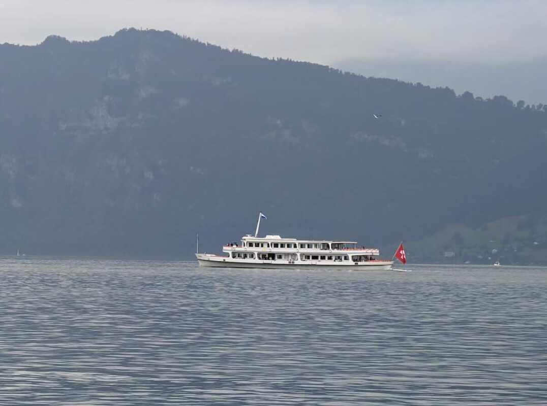 A passenger ferry glides across Lake Lucerne.