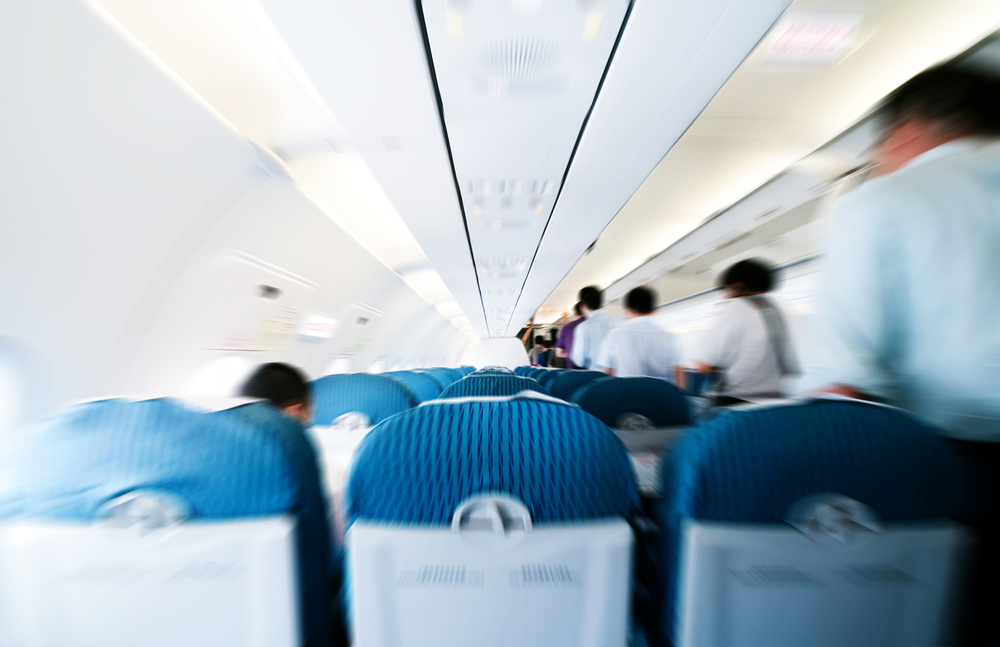 The "comfort" coach seats for which she'd paid had been changed. The airline re-seated her two rows away from her husband.