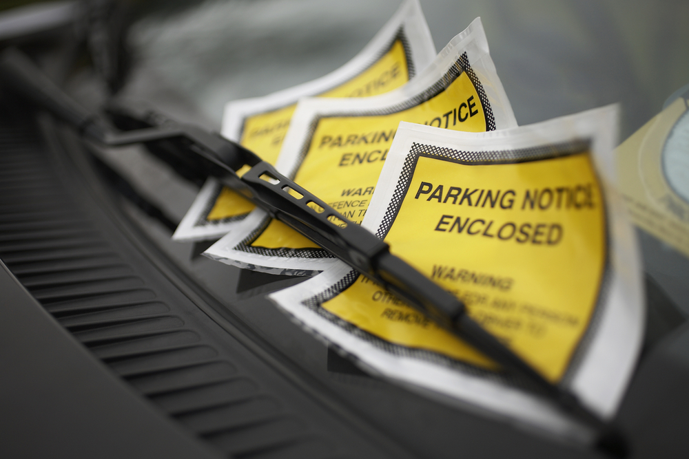 Even though Linda Troop pays for parking while she’s a guest at an Econo Lodge, she receives a parking ticket. Who has to pay?